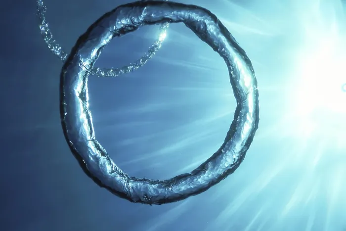 Framed Print : Bubble Ring Underwater Ascends Towards the Sun Print