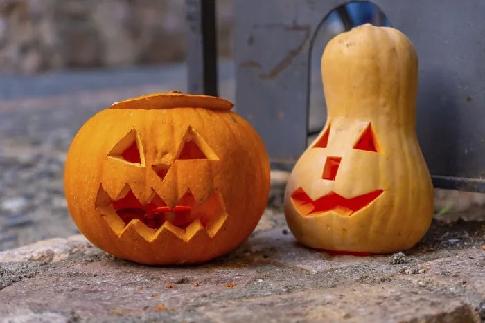 Framed Print : Two Carved Pumpkins on a Stone Surface Print