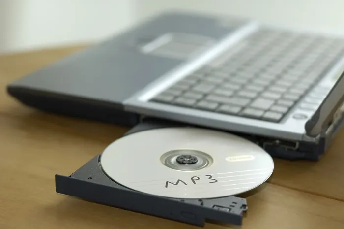 Framed Print : Print of CD labeled MP3 in notebook CD drive Framed Print : Print of CD labeled MP3 in notebook CD drive