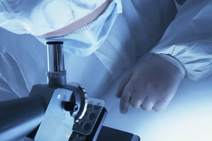 Framed Print : Chemist Examining Microscopic Print Framed Print : Chemist Examining Microscopic Print