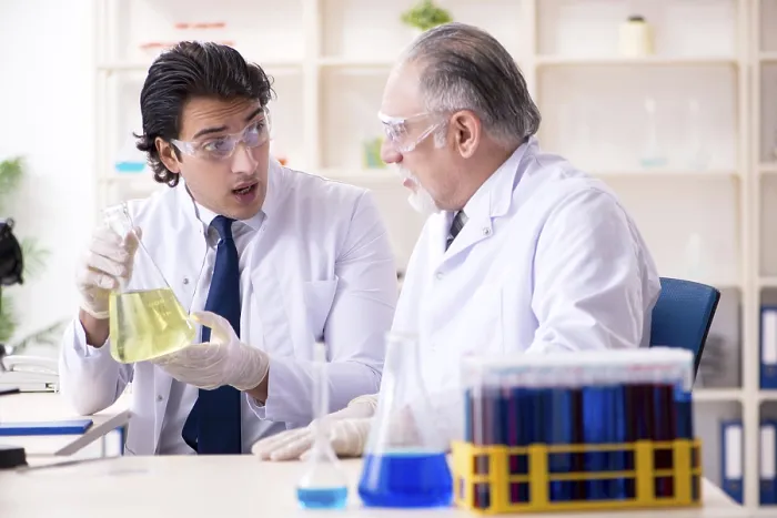 Framed Print : Two Chemists Working in a Laboratory Print Framed Print : Two Chemists Working in a Laboratory Print