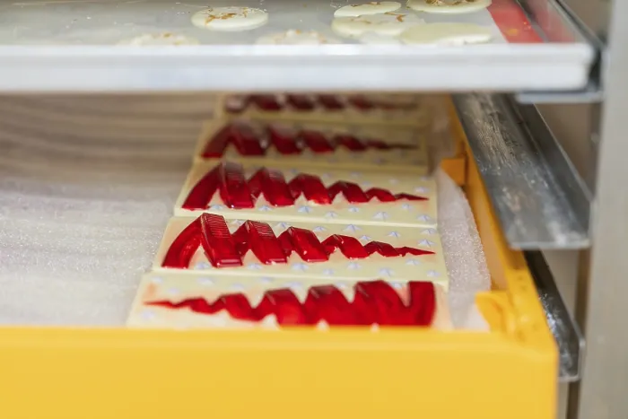 Framed Print : Chocolate Bars with Red Patterns in a Tray Print Framed Print : Chocolate Bars with Red Patterns in a Tray Print