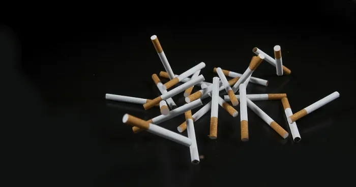 Framed Print : Cigarettes Falling Print against Black Background Framed Print : Cigarettes Falling Print against Black Background