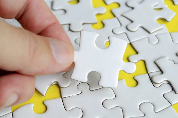 Framed Print : Close-up of Hand Placing Missing Jigsaw Puzzle Print Framed Print : Close-up of Hand Placing Missing Jigsaw Puzzle Print