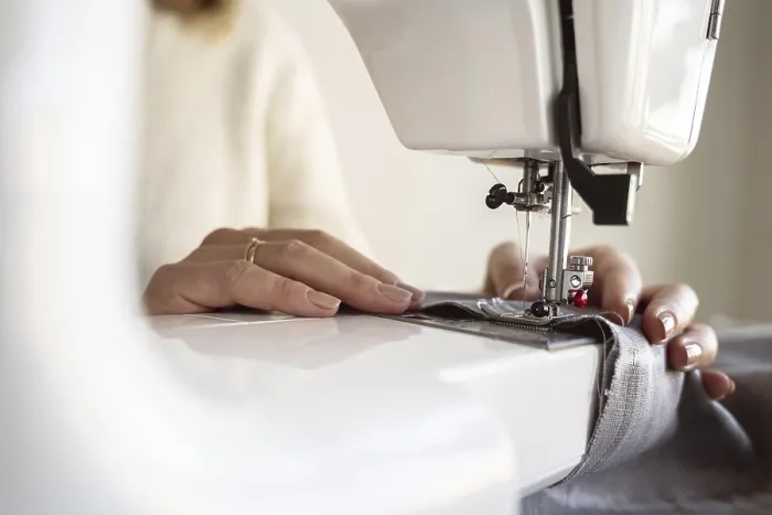 Framed Print : Close-up Print of Person Using Sewing Machine Framed Print : Close-up Print of Person Using Sewing Machine