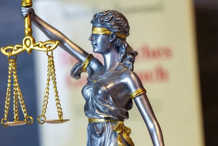 Framed Print : Close-up of a Justitia in front of the civil code Print Framed Print : Close-up of a Justitia in front of the civil code Print