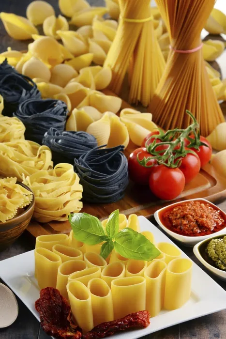 Framed Print : Composition with different sorts of pasta on kitchen table Print