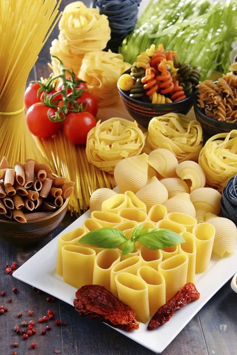Framed Print : Composition with different sorts of pasta on kitchen table Print