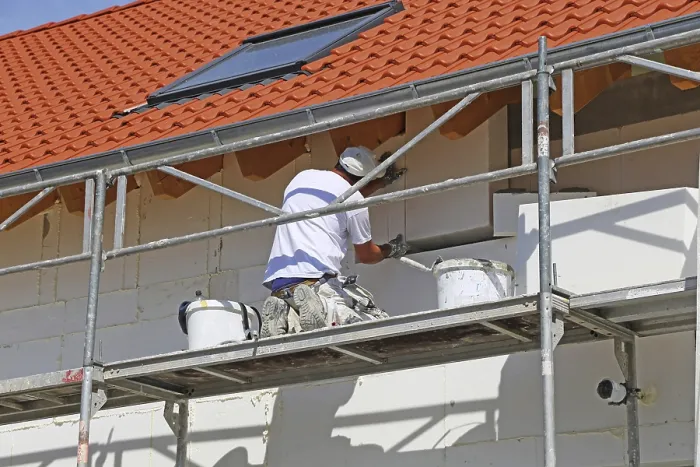 Framed Print : Construction Workers Insulate House Facade Print