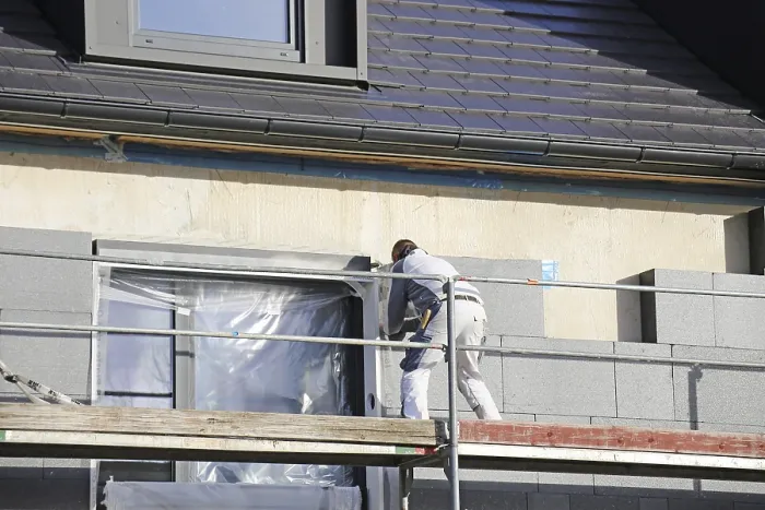 Framed Print : Construction Workers Insulate House Facade Print Framed Print : Construction Workers Insulate House Facade Print