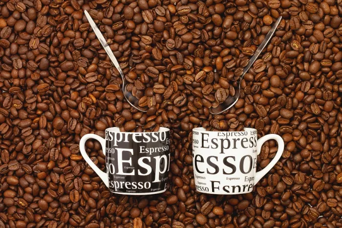 Framed Print : Two Cups of Coffee Print on a Table Full of Beans Framed Print : Two Cups of Coffee Print on a Table Full of Beans