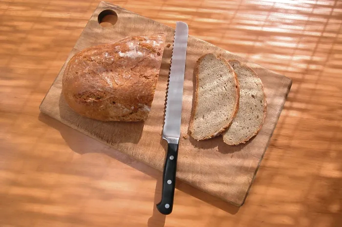 Framed Print : Cutting Bread Print Framed Print : Cutting Bread Print