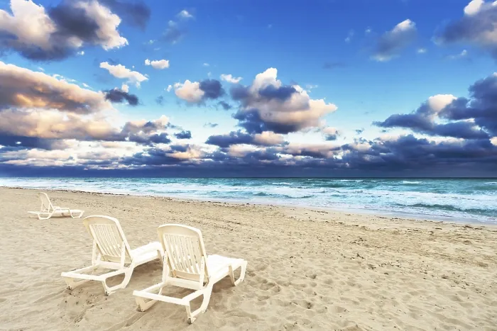 Framed Print : Deckchairs on a Beach Print - Ocean Background Framed Print : Deckchairs on a Beach Print - Ocean Background