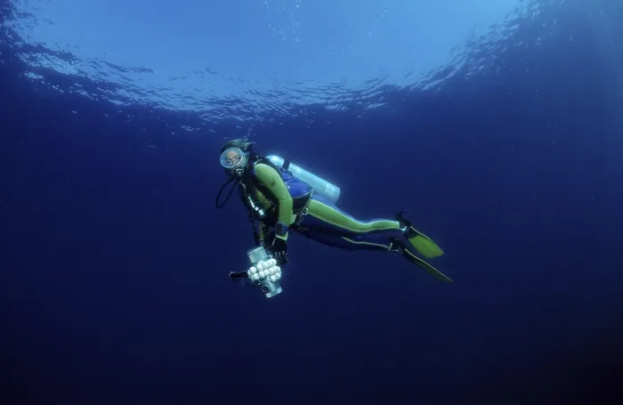 Framed Print : Diver Diving with Camera Equipment Print, Bali, Indonesia Framed Print : Diver Diving with Camera Equipment Print, Bali, Indonesia