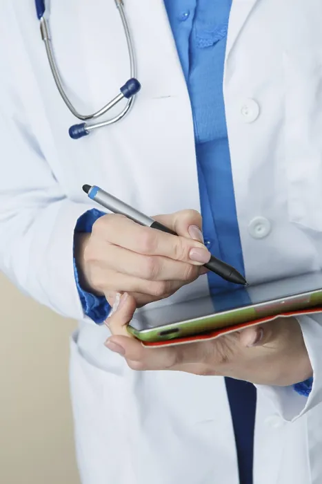 Framed Print : Doctor in White Coat Makes Notes at Work Print Framed Print : Doctor in White Coat Makes Notes at Work Print