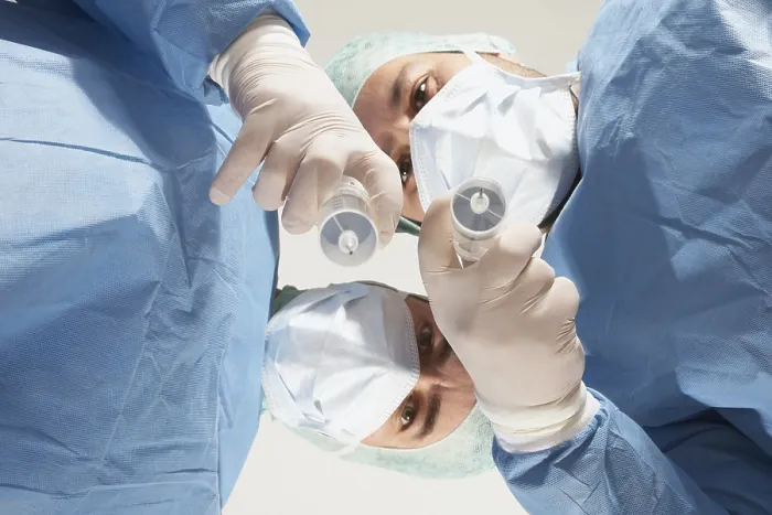 Framed Print : Two Doctors Preparing to Administer an Injection Print Framed Print : Two Doctors Preparing to Administer an Injection Print