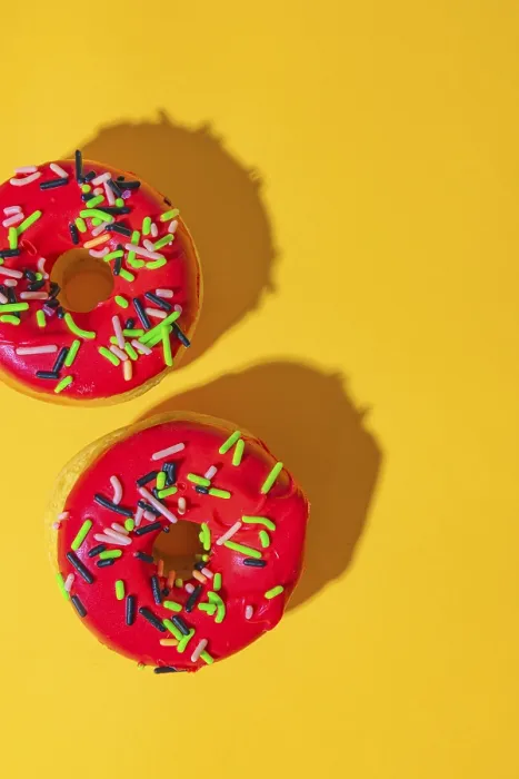 Framed Print : Donuts on Yellow Background Print with Red Icing Framed Print : Donuts on Yellow Background Print with Red Icing