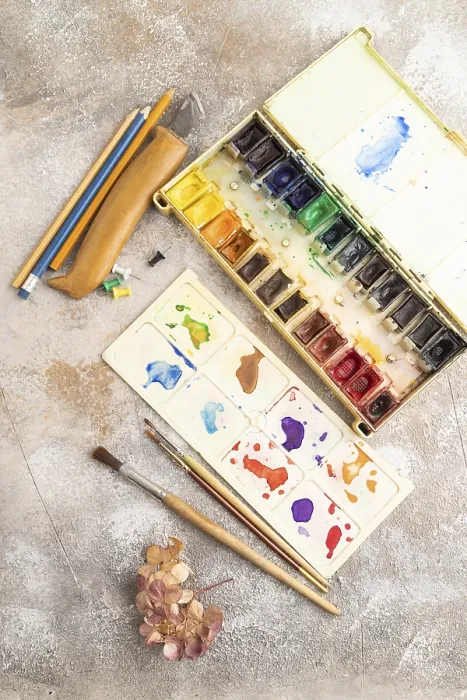 Framed Print : Drawing Accessories Print: Brushes, Pencils on Brown Concrete