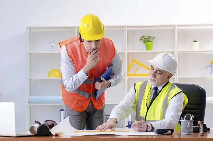Framed Print : Two Engineers Working Under Project Print