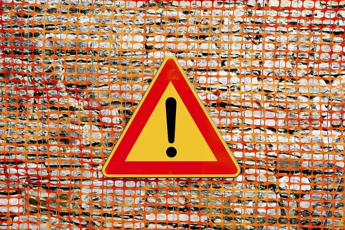 Framed Print : Yellow Plastic Mesh Fence Print with Red Triangular Sign Framed Print : Yellow Plastic Mesh Fence Print with Red Triangular Sign