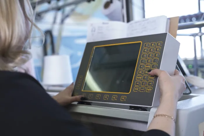Framed Print : Female Operator Setting Programme at Knitting Machine Print Framed Print : Female Operator Setting Programme at Knitting Machine Print