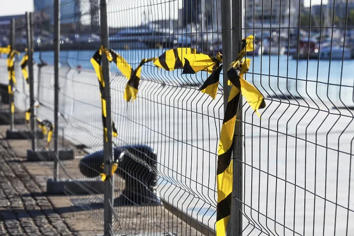Framed Print : Fence with ribbons on a construction site Print