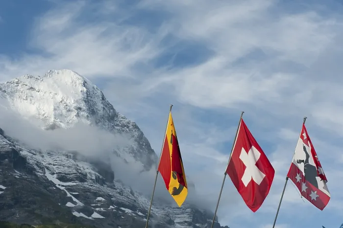 Framed Print : Flags in front of the snow-covered Eiger Mountain Print, Switzerland Framed Print : Flags in front of the snow-covered Eiger Mountain Print, Switzerland