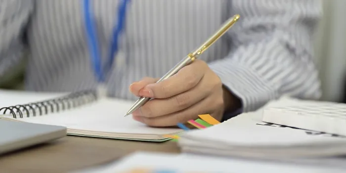 Framed Print : Focused Professional Writes Notes in a Notebook Print Framed Print : Focused Professional Writes Notes in a Notebook Print