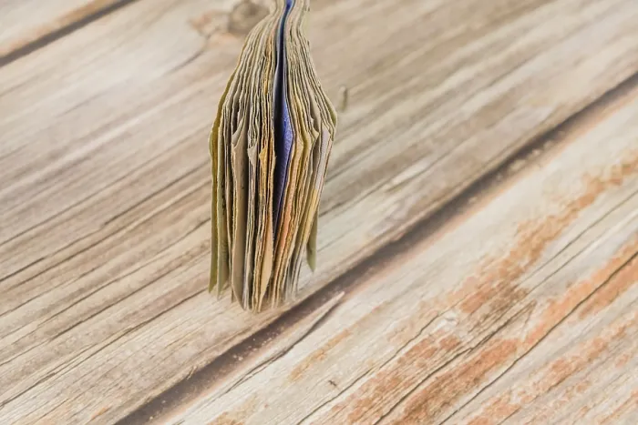 Framed Print : Folded Currency Notes Print on Wooden Table Framed Print : Folded Currency Notes Print on Wooden Table
