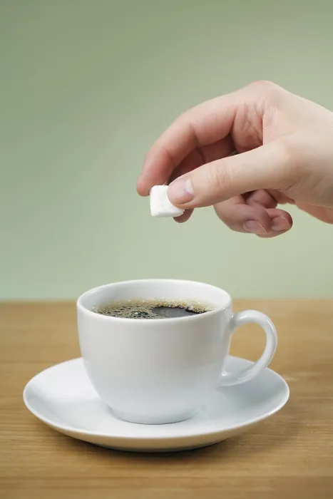 Framed Print : A Hand Adding Sugar to a Cup of Black Coffee Print Framed Print : A Hand Adding Sugar to a Cup of Black Coffee Print