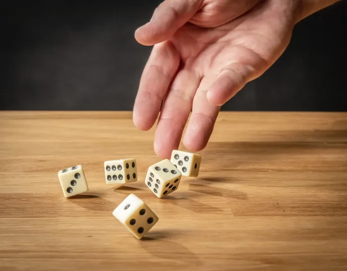 Framed Print : Hand throwing dice Print in Dark Background Framed Print : Hand throwing dice Print in Dark Background