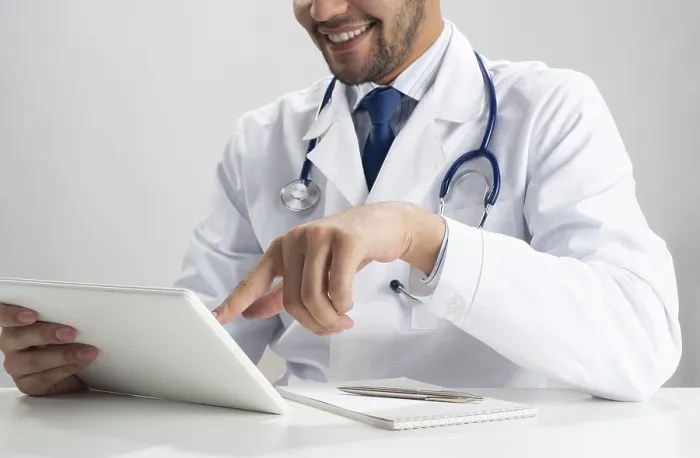 Framed Print : Happy Young Doctor Using Tablet Computer Print Framed Print : Happy Young Doctor Using Tablet Computer Print