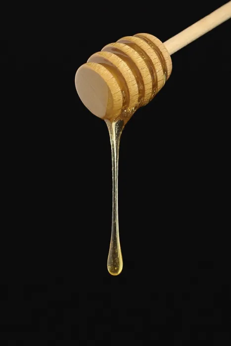 Framed Print : Honey falling from a dripper Print Framed Print : Honey falling from a dripper Print