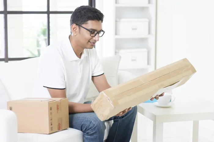 Framed Print : Indian Man Checking Express Parcel Print Framed Print : Indian Man Checking Express Parcel Print