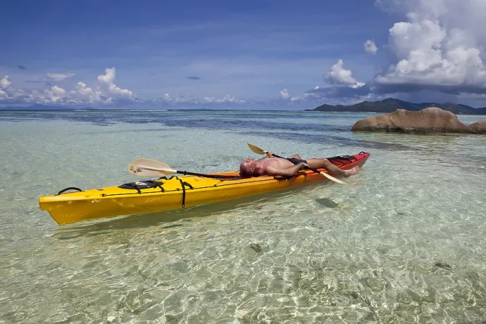 Framed Print : Kayaker at Anse Source d'Argent Print, Seychelles Framed Print : Kayaker at Anse Source d'Argent Print, Seychelles