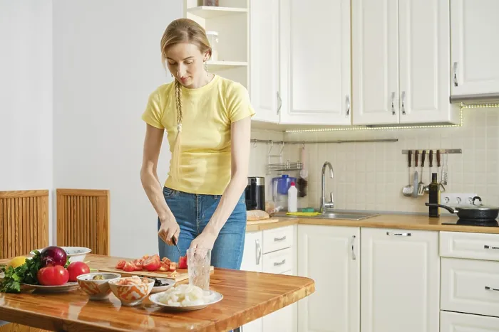 Framed Print : White Kitchen Scene Print: Woman Preparing Tomatoes