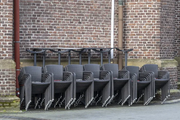 Framed Print : Stacked Chairs in Front of Brick Wall Print Framed Print : Stacked Chairs in Front of Brick Wall Print