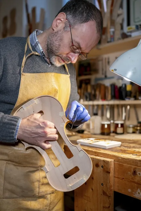 Framed Print : Luthier Restoring a Violin in Workshop Print Framed Print : Luthier Restoring a Violin in Workshop Print