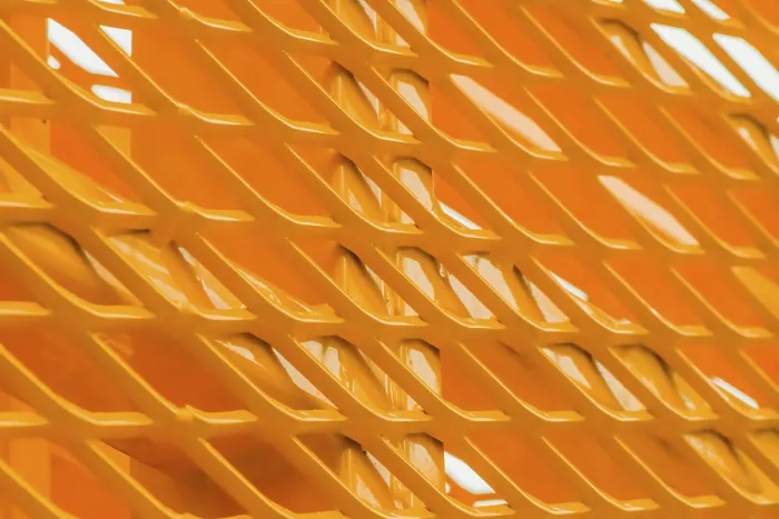 Framed Print : Macro Print of Yellow Metal Structure with V-Shaped Patterns