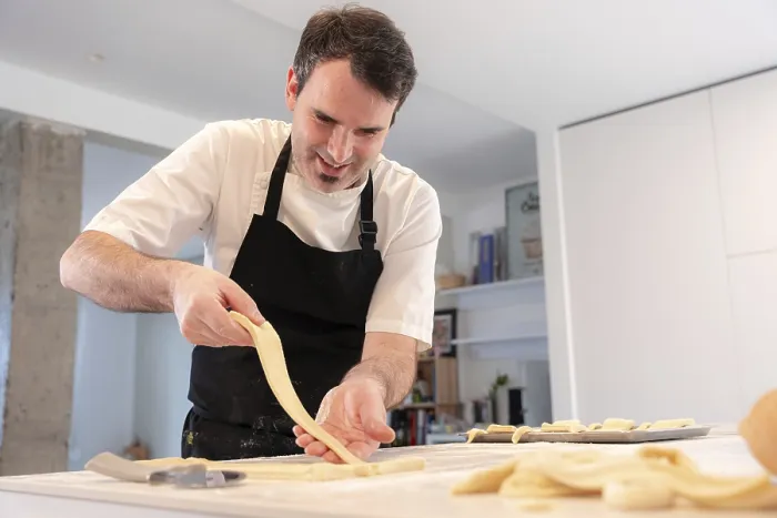Framed Print : A Man Bakes Croissants at Home Print