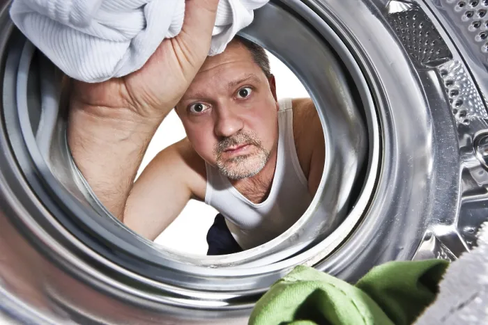 Framed Print : Man Loading Clothes to Washing Machine Print, Belgium Framed Print : Man Loading Clothes to Washing Machine Print, Belgium