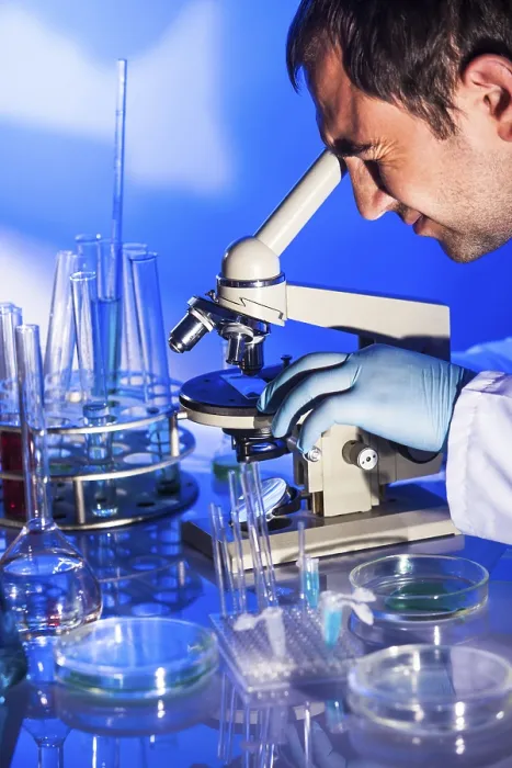 Framed Print : Scientist Examining Microscope Print Framed Print : Scientist Examining Microscope Print