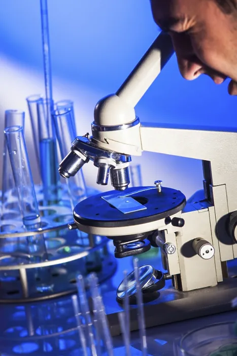 Framed Print : Scientist Examining Microscope Print Framed Print : Scientist Examining Microscope Print