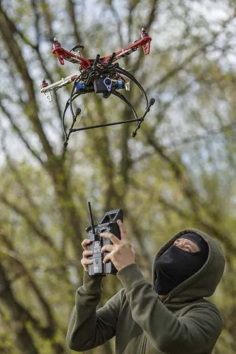 Framed Print : Man in Mask Operating a Drone with Remote Control Print Framed Print : Man in Mask Operating a Drone with Remote Control Print