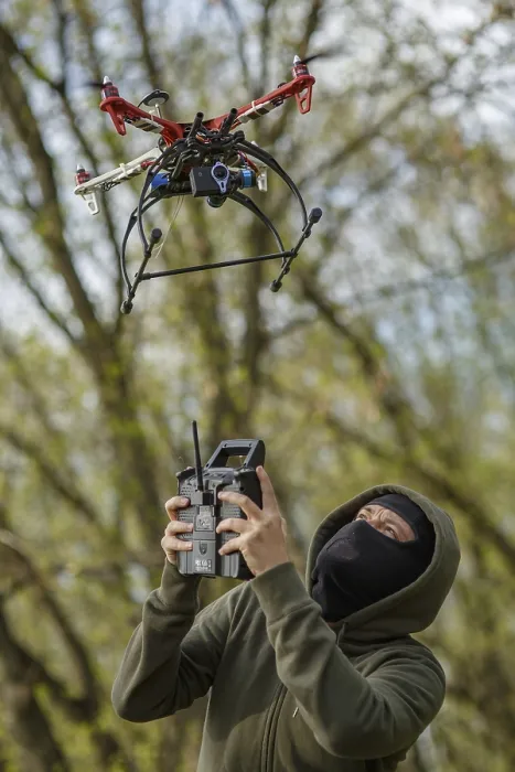 Framed Print : Man in Mask Operating Drone Print Framed Print : Man in Mask Operating Drone Print