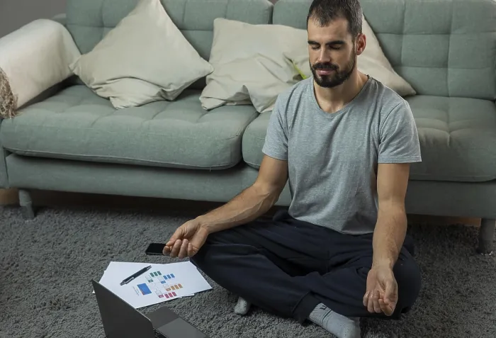 Framed Print : Man Meditating on Sofa Before Work Print Framed Print : Man Meditating on Sofa Before Work Print