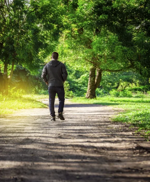 Framed Print : Man Walking Down a Desolate Road Print