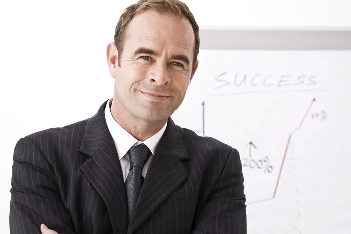 Framed Print : Manager Smiling Print - Standing in Front of Flipchart