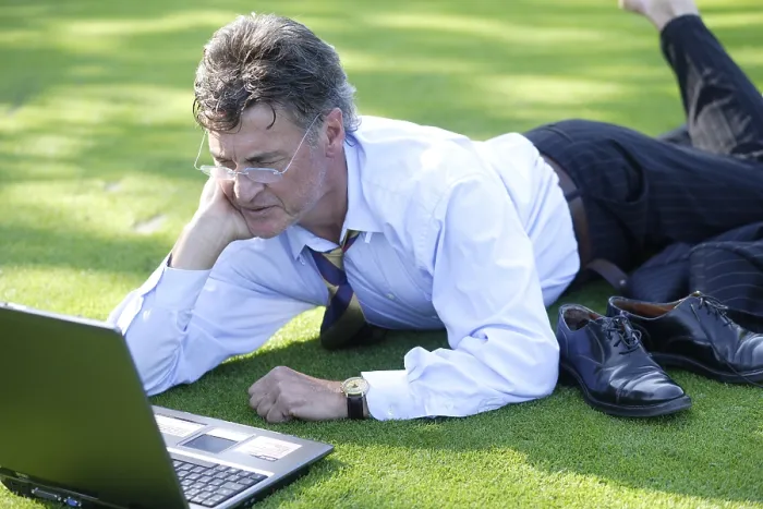 Framed Print : Manager Working on Notebook in Park Print Framed Print : Manager Working on Notebook in Park Print