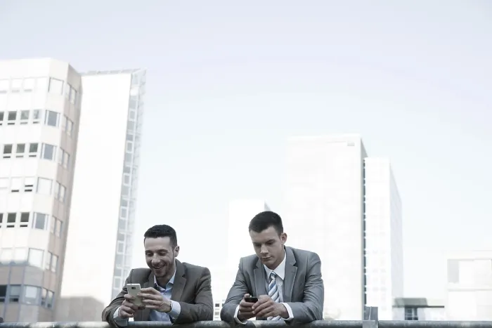 Framed Print : Two Managers Checking Smartphones Print Framed Print : Two Managers Checking Smartphones Print